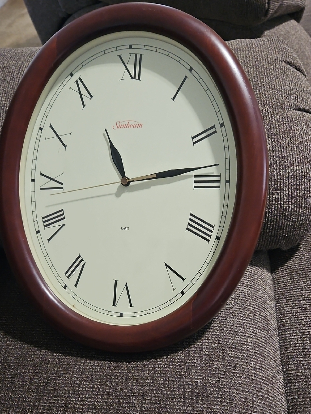 Sunbeam Cherry Brown Oval Wall Clock with Roman Numerals